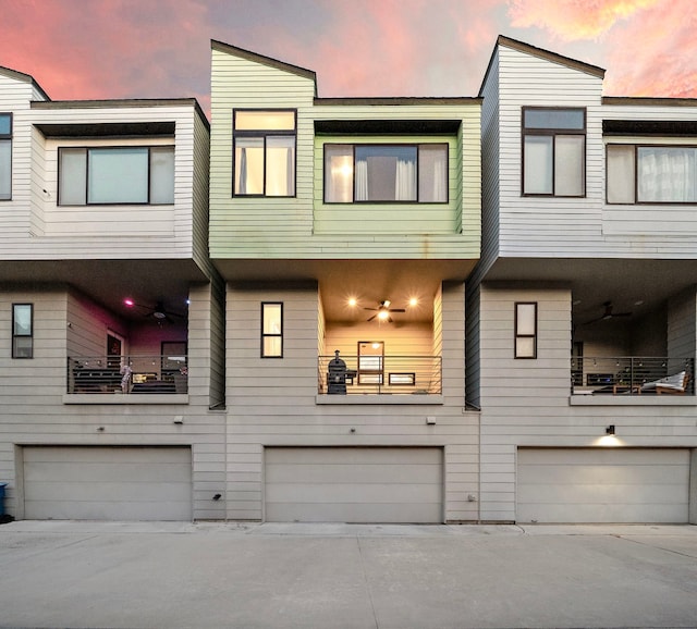 view of front of house featuring a balcony and a garage