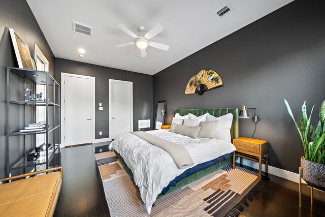 bedroom featuring ceiling fan and dark hardwood / wood-style flooring