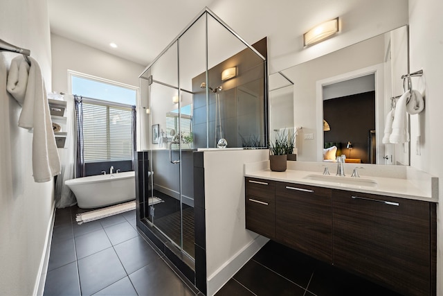 bathroom featuring tile patterned floors, independent shower and bath, and vanity