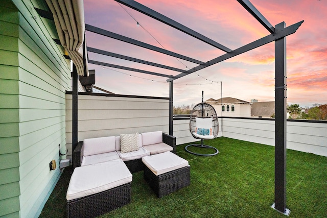 yard at dusk featuring an outdoor hangout area and a pergola