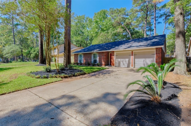 ranch-style home featuring a garage and a front lawn