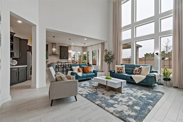 living room with a towering ceiling