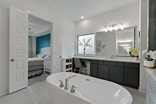 11111 Zinnias Ct, Cypress, TX 77433 - bathroom with ensuite bathroom, recessed lighting, vanity, and a freestanding bath