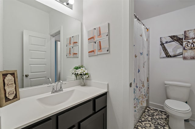 bathroom with vanity, toilet, and a shower with shower curtain