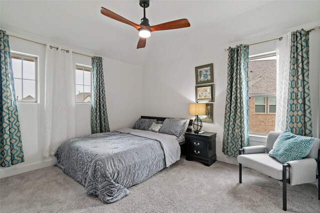 carpeted bedroom with lofted ceiling and ceiling fan