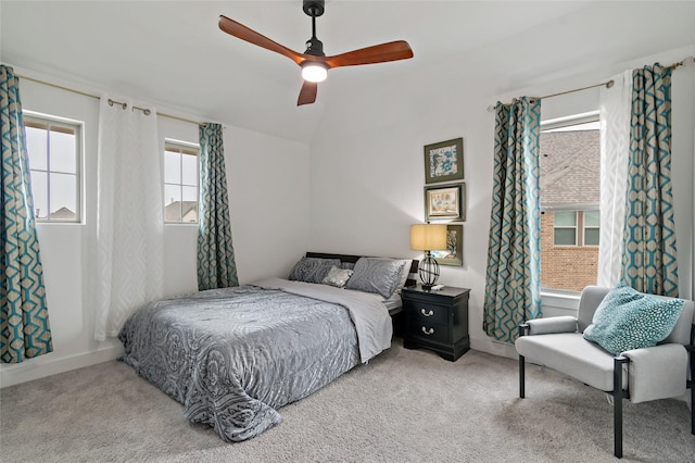 bedroom featuring lofted ceiling, ceiling fan, carpet flooring, and baseboards