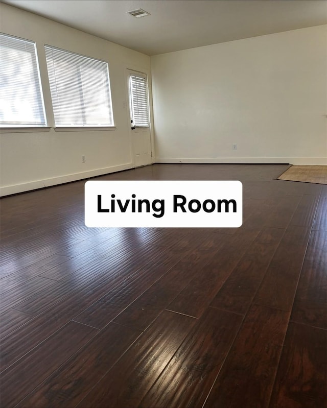 empty room featuring dark hardwood / wood-style flooring