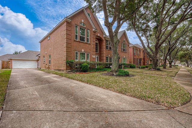 view of front of property with a garage and a front yard