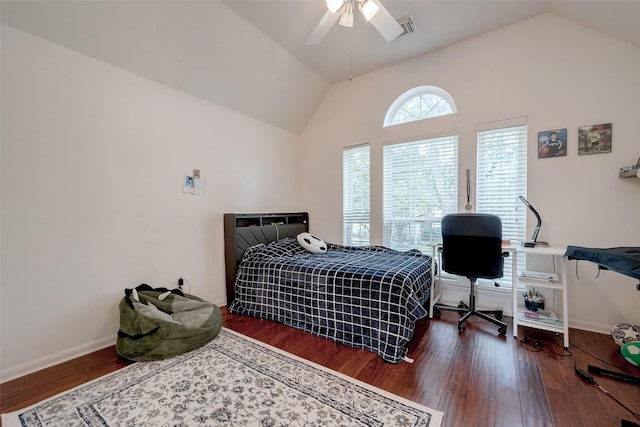 bedroom with dark wood-type flooring, ceiling fan, and vaulted ceiling