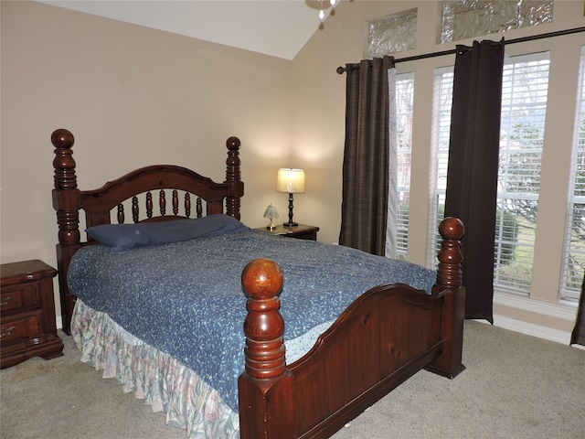 bedroom with carpet flooring and vaulted ceiling