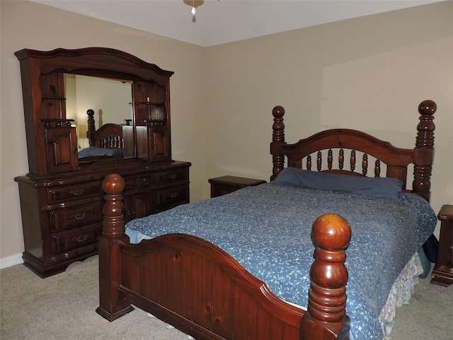 bedroom featuring light colored carpet