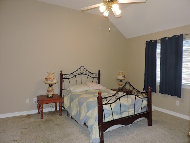 carpeted bedroom with vaulted ceiling and ceiling fan