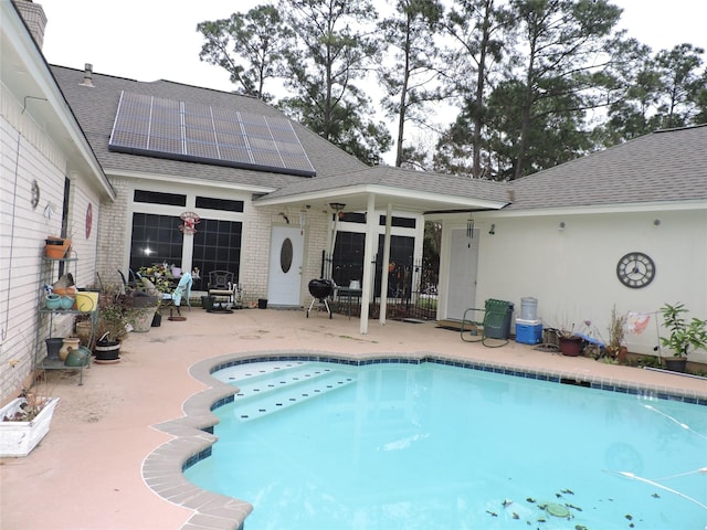 view of swimming pool featuring a patio