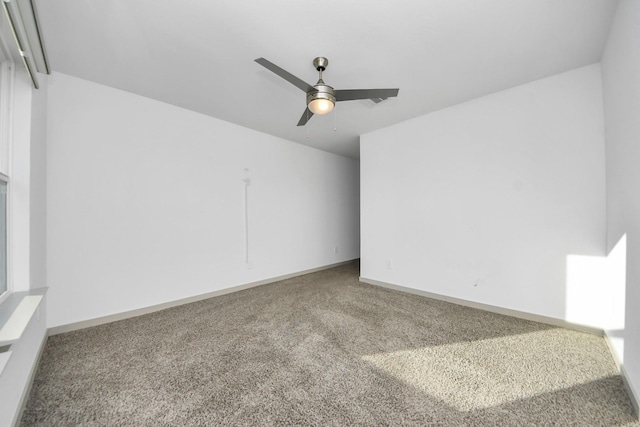 carpeted empty room with ceiling fan