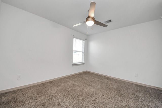 unfurnished room featuring ceiling fan and carpet floors