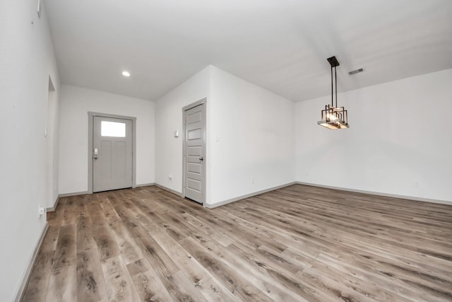 foyer entrance with light hardwood / wood-style flooring