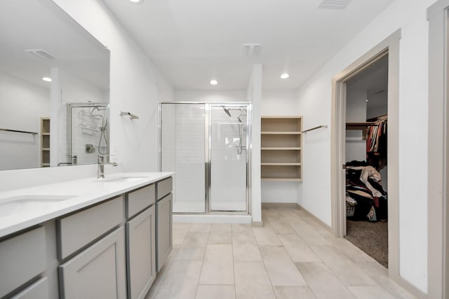 bathroom with vanity and walk in shower