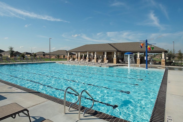 view of pool with pool water feature