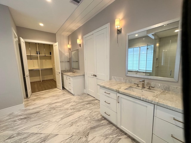 bathroom with vanity and walk in shower