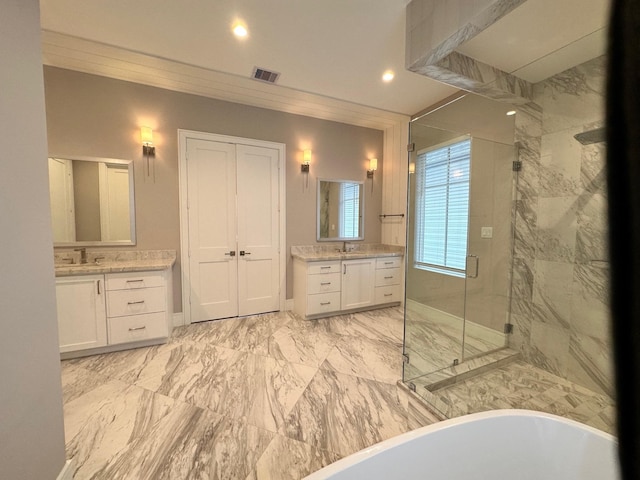 bathroom featuring vanity and separate shower and tub