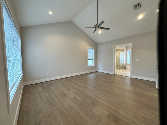 unfurnished living room featuring hardwood / wood-style flooring, high vaulted ceiling, and ceiling fan