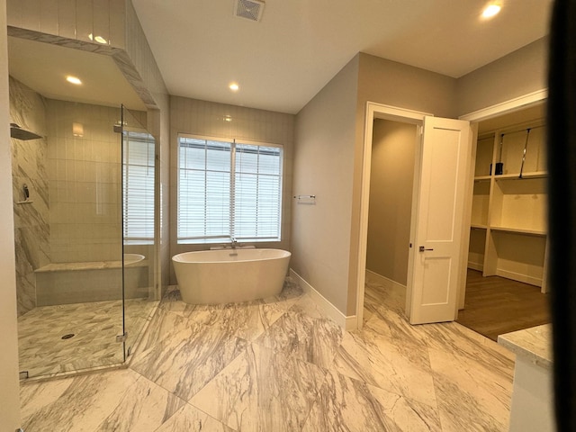 bathroom featuring plus walk in shower