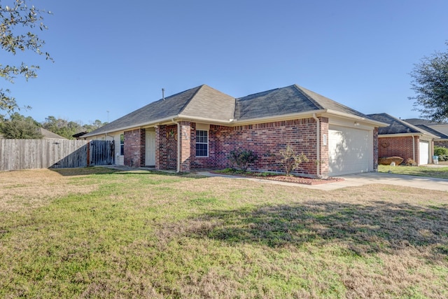 single story home featuring a garage and a front yard