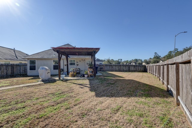 view of yard with a pergola and a patio