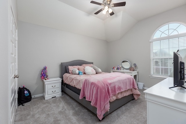 carpeted bedroom featuring lofted ceiling and ceiling fan