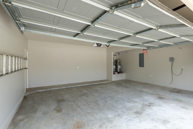 garage with a garage door opener, electric panel, and water heater