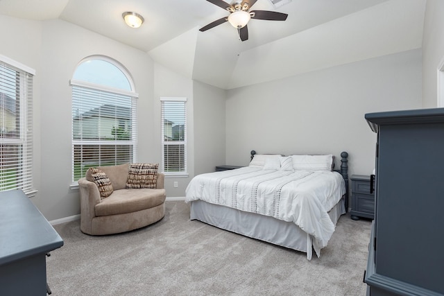 carpeted bedroom with ceiling fan and lofted ceiling