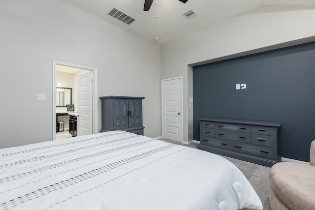 bedroom featuring ceiling fan, vaulted ceiling, and light carpet