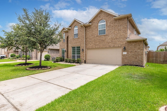 front of property featuring a garage and a front yard