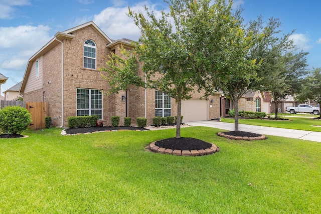 view of front of property featuring a garage and a front yard