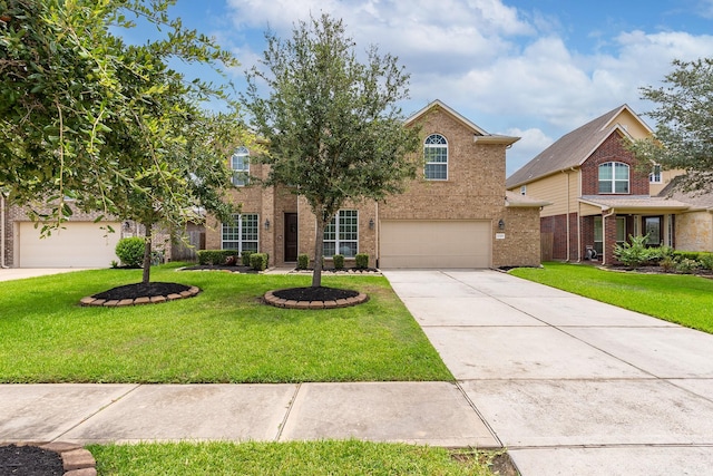 front facade featuring a garage and a front lawn