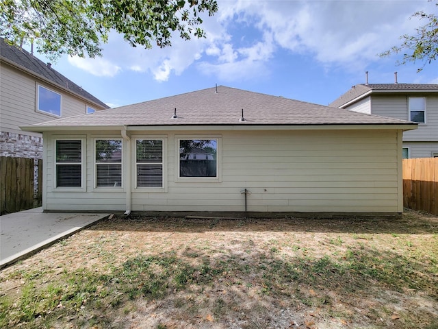 back of property with a patio area