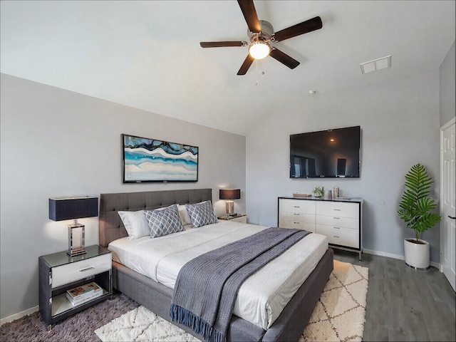 bedroom featuring light hardwood / wood-style flooring, vaulted ceiling, and ceiling fan