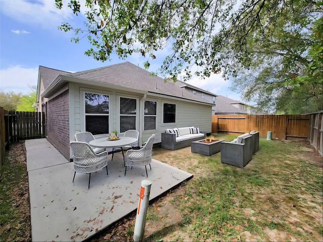 back of house with a patio, an outdoor living space with a fire pit, and a lawn