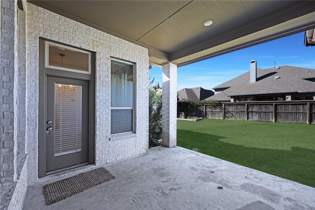 exterior space featuring a lawn and a patio