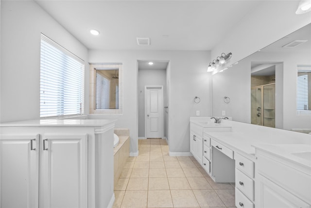 bathroom with vanity, plus walk in shower, and tile patterned flooring