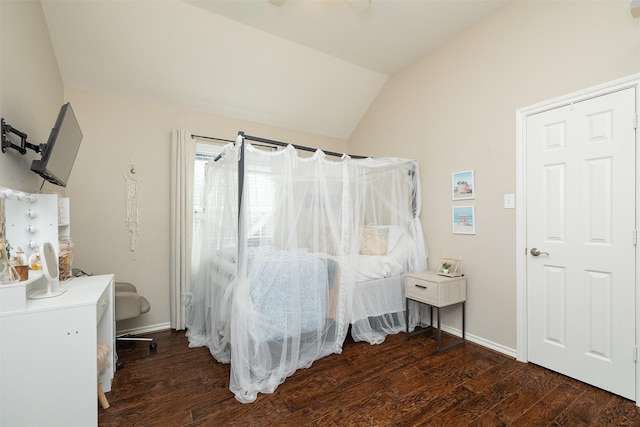 bedroom featuring dark hardwood / wood-style flooring and vaulted ceiling