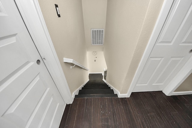 stairway featuring hardwood / wood-style flooring