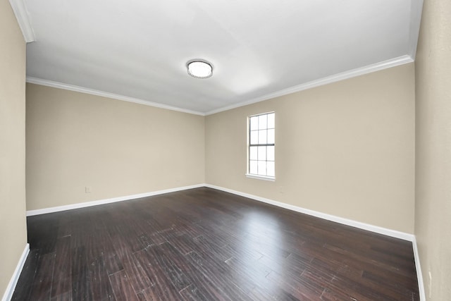 unfurnished room featuring ornamental molding and dark hardwood / wood-style floors