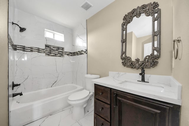 full bathroom with vanity, toilet, and tiled shower / bath combo