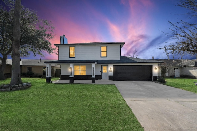 view of front of house with a garage, a porch, and a lawn