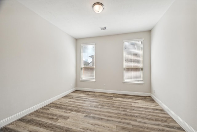 unfurnished room featuring light hardwood / wood-style flooring