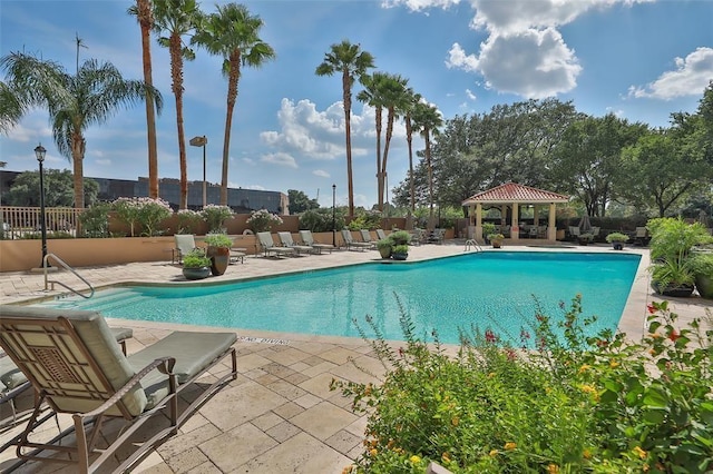 view of swimming pool featuring a gazebo and a patio