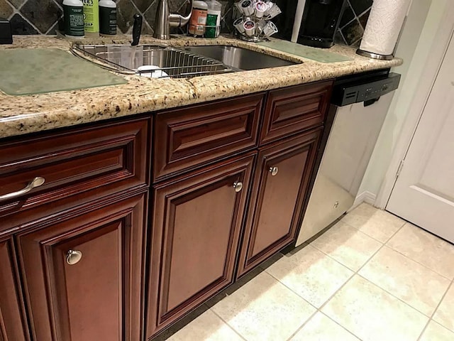 bathroom featuring tile patterned flooring and sink