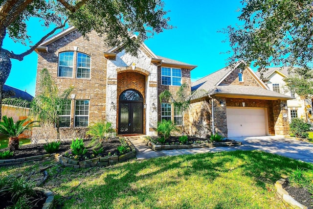 view of front of home with a garage, a front lawn, and french doors