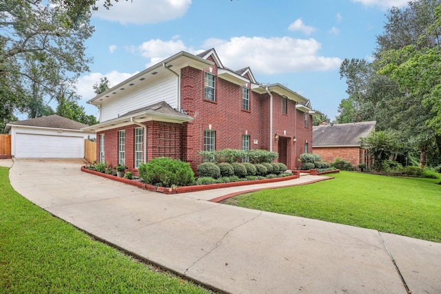 view of front of house featuring a garage and a front yard